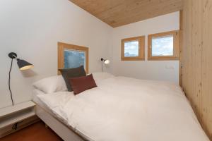 Letto o letti in una camera di Chasa Laina