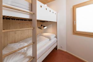Letto o letti in una camera di Chasa Laina