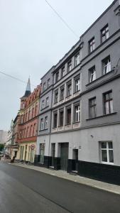 a row of buildings on the side of a street at Apartament WHITEGRAY Studio 105 m2 in Bytom