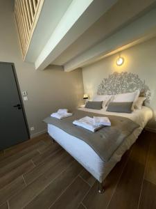 Postel nebo postele na pokoji v ubytování La Maison de l'Olivier