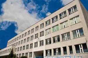 a large white building with many windows on it at Hotel Akor in Bydgoszcz