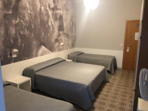 Postel nebo postele na pokoji v ubytování Hotel Wega