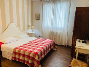 Postel nebo postele na pokoji v ubytování B&B Al Ponte
