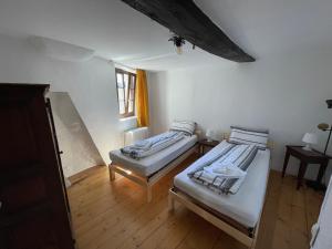 Postel nebo postele na pokoji v ubytování Tipica casa ticinese a Carona