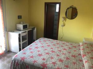 Postel nebo postele na pokoji v ubytování Hotel Wega