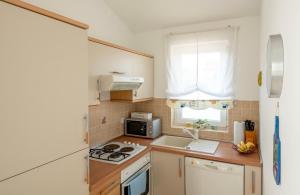 Η κουζίνα ή μικρή κουζίνα στο Sisi Apartment