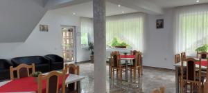 a dining room with a table and chairs at La Cascade 2 in Moieciu de Sus