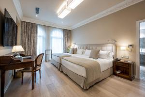 Voodi või voodid majutusasutuse Hotel Rector toas