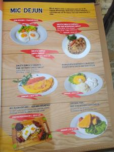 a menu for a mcdonalds restaurant with plates of food at HOTEL ADRIANO in Brăila