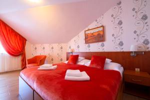 Postel nebo postele na pokoji v ubytování Spa & Wellness Hotel Orchidea