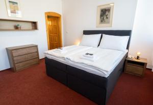 Posteľ alebo postele v izbe v ubytovaní Hotel Uno