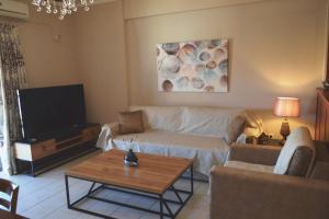 A television and/or entertainment centre at Best House, Sea View II, Pylos Messinias