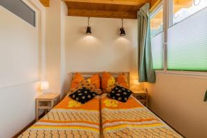 Ένα ή περισσότερα κρεβάτια σε δωμάτιο στο K2 Brunnen Haus