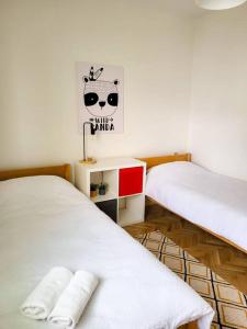 Łóżko lub łóżka w pokoju w obiekcie Zagi Apartment 2