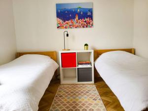 Postel nebo postele na pokoji v ubytování Zagi Apartment 2