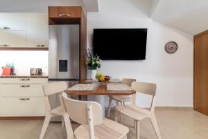 A kitchen or kitchenette at Eleni Luxury Maisonette with Jacuzzi