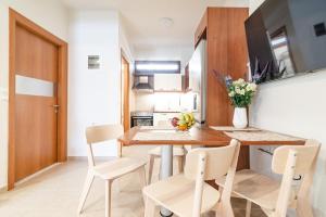 A television and/or entertainment centre at Eleni Luxury Maisonette with Jacuzzi