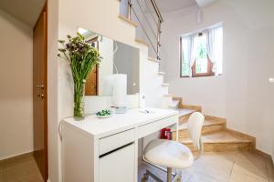 A kitchen or kitchenette at Eleni Luxury Maisonette with Jacuzzi