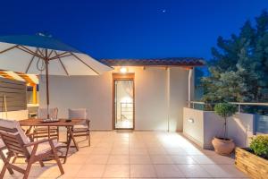 A patio or other outdoor area at Eleni Luxury Maisonette with Jacuzzi