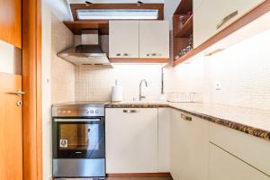 A kitchen or kitchenette at Eleni Luxury Maisonette with Jacuzzi