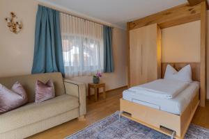 Postel nebo postele na pokoji v ubytování SR Apartments GmbH Rabitschhof