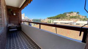a balcony of a building with a view of a city at Can-Carma El Conserje in Denia