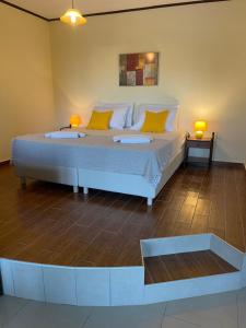 A bed or beds in a room at Cavo Plako Villas
