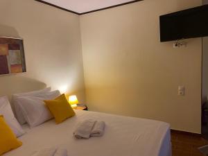 A bed or beds in a room at Cavo Plako Villas