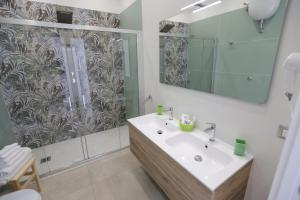 a bathroom with a sink and a shower at M'incanto B&B in Naples