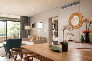 a living room with a table and a couch at Striking 2 Bed Zimbali Suites Sea-View in Ballito