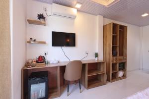 TV a/nebo společenská místnost v ubytování Batuta Maldives Fourson