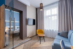 Televízia a/alebo spoločenská miestnosť v ubytovaní Avena Boutique Hotel by Artery Hotels
