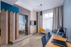 Televízia a/alebo spoločenská miestnosť v ubytovaní Avena Boutique Hotel by Artery Hotels