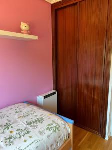 Łóżko lub łóżka w pokoju w obiekcie TERRAZA PLAYA BAIONA
