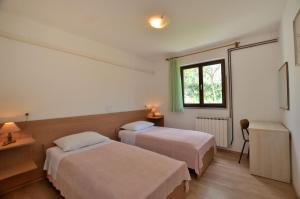 Postel nebo postele na pokoji v ubytování Apartment Luna