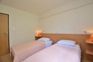 Postel nebo postele na pokoji v ubytování Apartment Luna