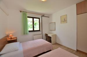 Postel nebo postele na pokoji v ubytování Apartment Luna
