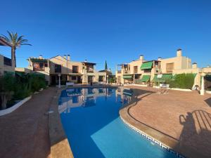 a view of a swimming pool in a resort at Tu Casa in Puerto de Mazarrón