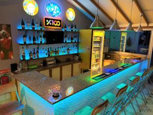 a bar in a restaurant with a blue counter at Casablanca Hotel in Dalyan