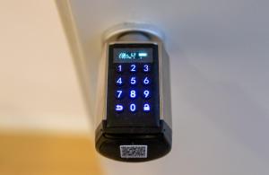 a close up of a remote control hanging on a door at La Piazzetta Suite in Potenza