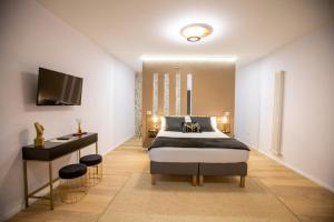 En eller flere senge i et værelse på La Piazzetta Suite