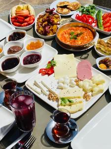a table with many plates of food on it at Casablanca Hotel in Dalyan
