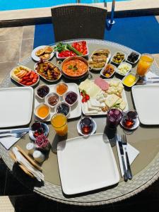 a table with a bunch of food on it at Casablanca Hotel in Dalyan