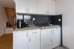Kuchyňa alebo kuchynka v ubytovaní Apartments Natalija