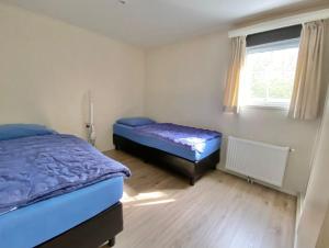 Postel nebo postele na pokoji v ubytování 'T Groentje Baarland + 22 fotografií