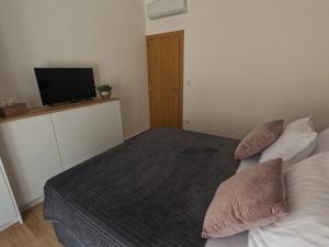 Posteľ alebo postele v izbe v ubytovaní Sea and mountain view apartments