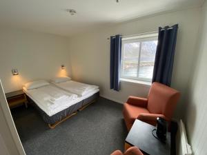 Postel nebo postele na pokoji v ubytování Fast Hotel Henningsvær