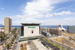 a building with a sign on it in a city at Home2Book Stunning Santa Cruz City Views in Santa Cruz de Tenerife