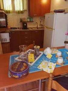 a kitchen with a table with food on it at Appartamenti le conchiglie e le Stelle Marine in Cala Gonone