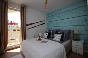 מיטה או מיטות בחדר ב-Morskie klimaty - Rejs